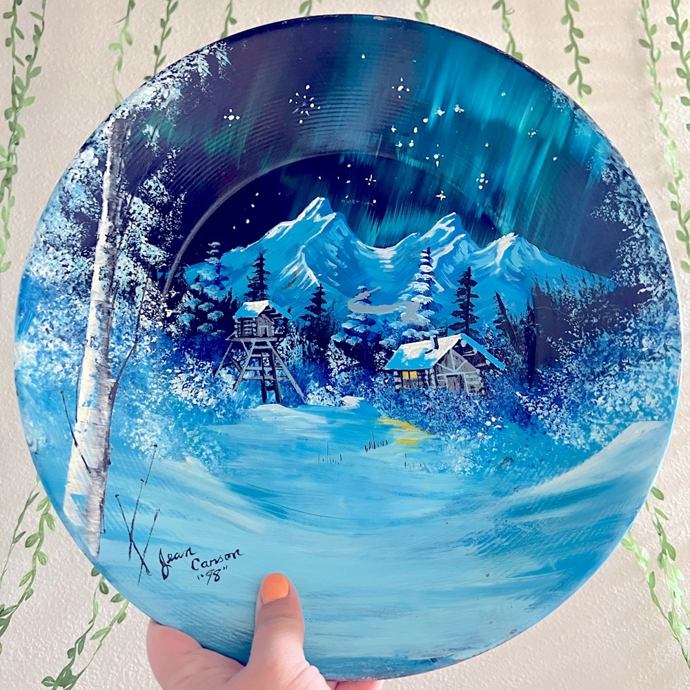 Hand painted cabin on a metal pan by Jean Carson 98’